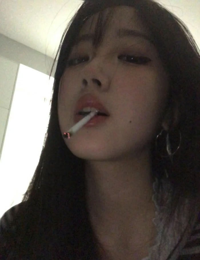 smoking girl dp in moody cinematic background.