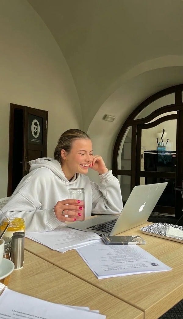 study girl dp with desk lamp and open textbook.