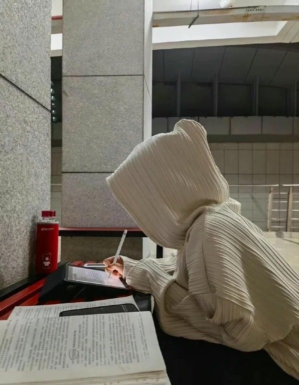 study girl dp with gentle smile while reading.