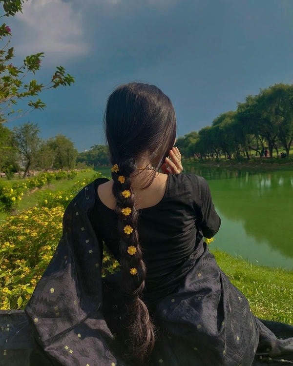 lovely village girls dp sitting in green farmland.